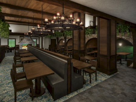 A cozy dining area with long wooden booths, tables, chandeliers, arches, plants, and a vintage tavern vibe.